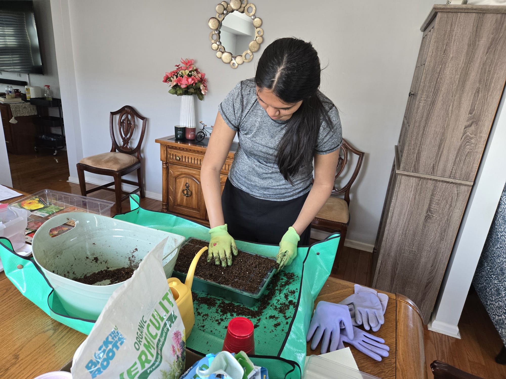 Filling seed-starting tray with soil