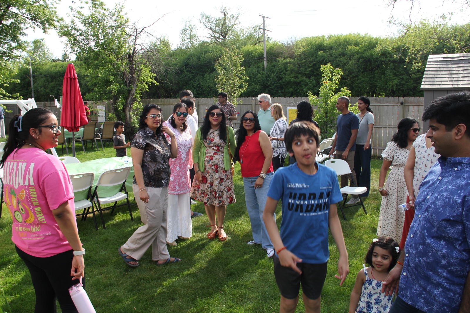 Guests walking through the backyard during the project process discussion