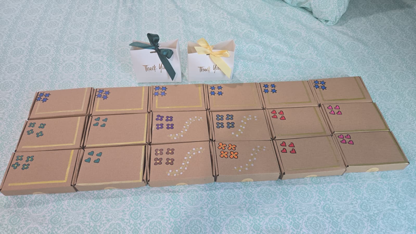 Hand-decorated kraft prize boxes and Thank You favor bags arranged as bingo awards